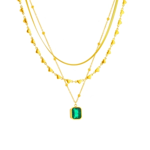 Layered gold snake chain necklace with heart and emerald green rectangle pendant