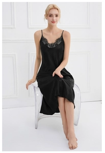 Detail of elegant black satin nightgown featuring delicate eyelash lace trim on V-neckline