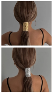 Detailed view of hammered metal ponytail cuffs in gold and silver finishes