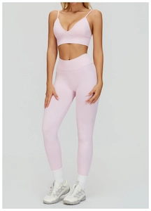 Pink seamless yoga set with V-neck sports bra and high-waist leggings for fitness