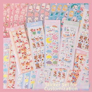 Close-up of cute cartoon bear and bunny stickers in pastel colors for DIY journals
