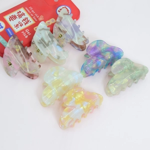 Vintage heart-shaped PVC hair claws in various marble patterns for elegant hairstyling