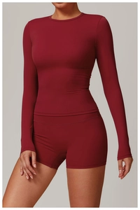 Detail of high-stretch dark red brushed yoga set featuring seamless stitching and crew neck