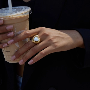 Detailed close-up of a heart-shaped pearl ring with thick 18k gold plated stainless steel