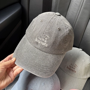Close-up of embroidered Scottish Terrier dog and keynote text on washed cotton baseball cap