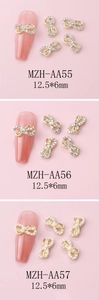 Three bow nail art charms in gold finish with crystals and pearls, size 12.5x6mm