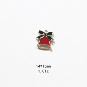 Close-up of red and green enamel Christmas bell charm with gold bow, 14x15mm size