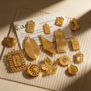 Set of 14 vintage gold geometric pendants featuring sun, moon, and floral designs for DIY