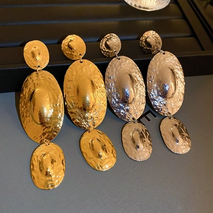 Exaggerated gold and silver metallic geometric drop earrings with hammered texture