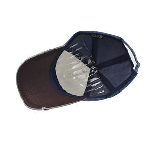 Internal view of a washed denim cap with 100% cotton label and shape protector
