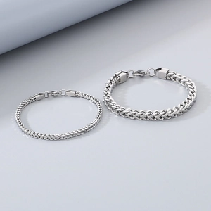 Minimalist silver stainless steel curb chain bracelet shown in two widths for unisex style