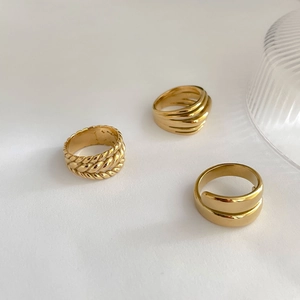 Three-piece set of gold layered twist and ribbed rings in minimalist vintage style
