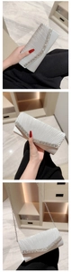 Close-up of pleated silver silk evening clutch with luxury crystal fringe and chain