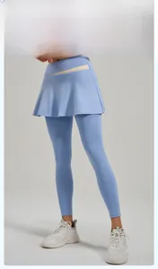 Detail of high-waist 2-in-1 yoga leggings with skirt and contrast color trim on model