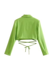 Detail of lime green cropped blazer with stylish open back lace-up design and metal buttons