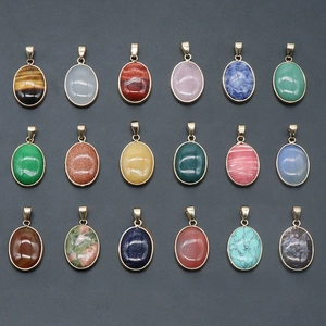 Variety of 18 oval natural gemstone pendants in gold-plated bezel settings