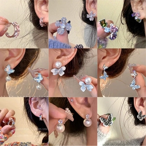 Collage of chic gold earrings with pearls, bows, and crystals in Korean fashion style