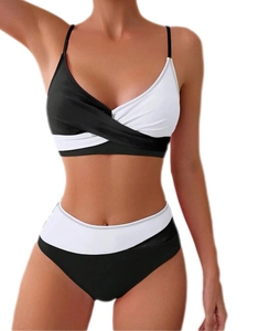 Detail of black and white color block bikini set featuring cross-wrap design and high waist