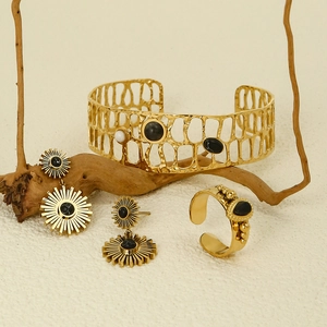 Golden sunflower jewelry set featuring black stone inlay bracelet earrings and open ring