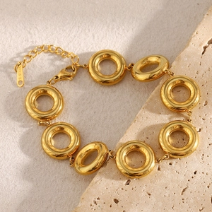 Macro shot of 18K gold plated solid round link chain bracelet in stainless steel