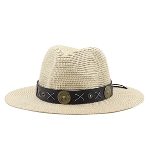 Bohemian straw sun hat with black leather band and vintage metal accents for summer vacation