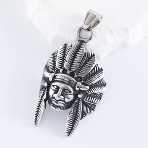 Macro shot of silver stainless steel Indian chief pendant with feather headdress detail