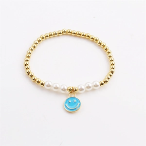 Golden bead and pearl bracelet featuring a sky blue enamel smiley face charm on white back