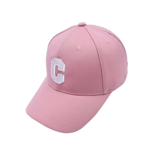 Close-up of embroidered white letter C patch on a pink twill cotton baseball cap