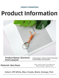Macro view of 12cm hand-woven orange wax rope Vajra knot lanyard with a silver metal ring