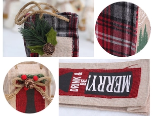 Detailed macro view of rustic burlap Christmas wine bags with festive pinecone accents