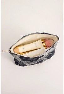 Deep blue floral jacquard makeup bag interior view showing large storage capacity