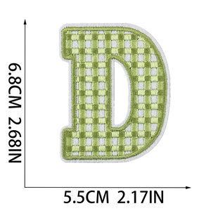 Detail showing the size and texture of yellow plaid letter D Easter embroidery patch