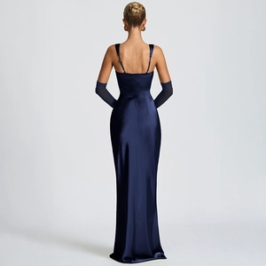 Detail of navy blue satin evening gown featuring an open back and long matching gloves