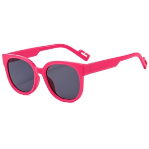 Retro rose pink round frame sunglasses with dark lenses and vintage matte finish