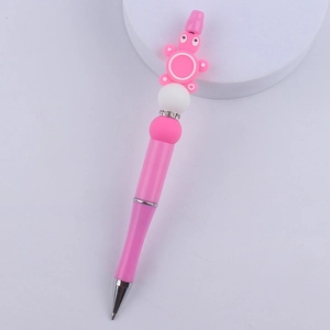 Detail of pink cartoon animal silicone bead pen with sparkling rhinestone ring accents