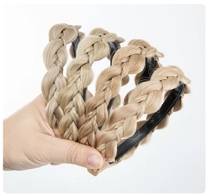 Detail of four golden brown braided synthetic hair headbands with non-slip inner grips