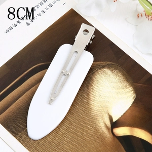 Detail view of a 8CM minimalist white acetate hair clip with a sturdy metal duckbill base