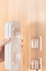 Macro detail of clear self-adhesive mounting buckle used for organizing router boxes