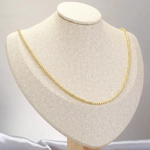 Elegant gold box chain necklace displayed on a white bust model for everyday styling