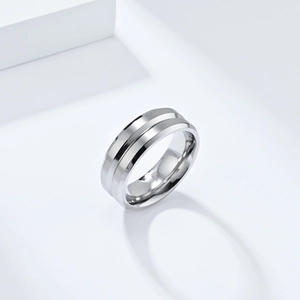 Detailed macro view of silver titanium steel ring with V-groove and brushed metal finish