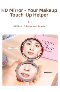 Detail of portable silver folding mirror with 2x magnification and 1:1 HD view