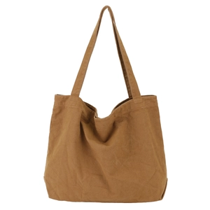 Minimalist brown canvas tote bag for women shown hanging against a white background