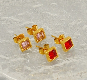Detailed view of pink and red square zircon stud earrings in gold beaded settings