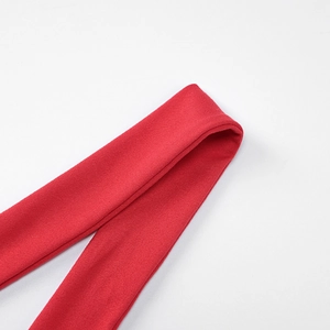 Detail of red elastic knit fabric with premium stitching on shoulder strap seam