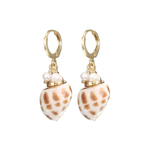 Golden seashell drop earrings with natural mother of pearl and pearls on white background