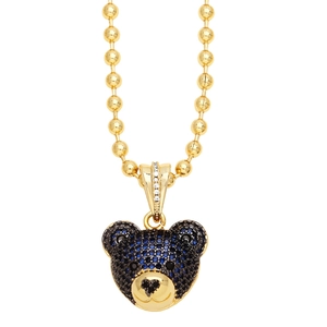 Macro shot of gold-plated bear pendant with blue and black pavé crystals on beaded chain