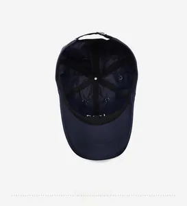 Detail view of the navy blue quick-dry baseball cap interior with reinforced black tape