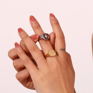Polished 18K gold and silver stainless steel rings with North Star starburst engraving