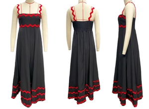 Three-view layout of black maxi dress with red wavy ribbon trim on mannequin display