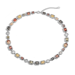 Detailed shot of luxury multi-colored gemstone choker with silver settings and heart charm